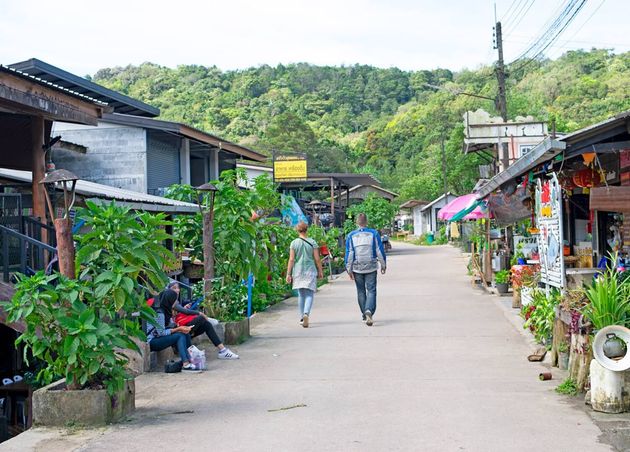 People Walking on A Clean Road in Beautiful Village Pilok Thailand