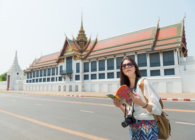 Beautiful Elegance Female Traveler Visiting Bangkok Famous Grand Palace Holding Travel Guidebook Viewing Culture Information Thailand Travel Vacation