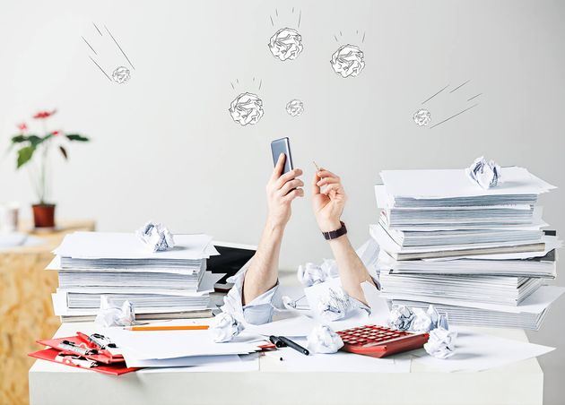 Conceptual Image Collage about Many Crumpled Papers Desk Stressed Male Workplace