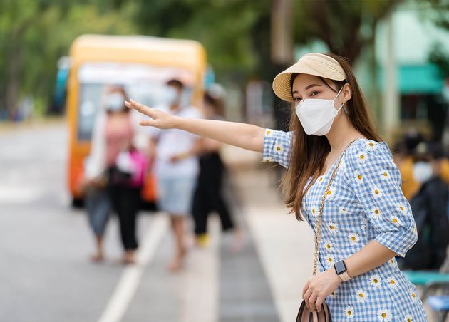 Woman with Medical Mask Protect Coronaviruscovid19 while Waiting Bus Bus Stop City