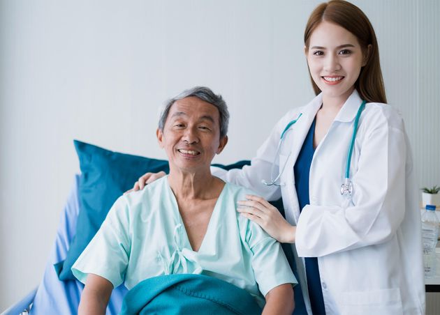 Attractive Asian Woman Nurse Doctor Working with Smiling Freshness Together Takecare Ill Old Senior Patient Hospital