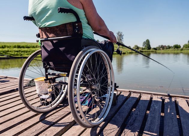 Young Disabled Man Wheelchair Fishing