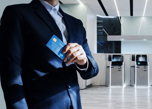 Bank Manager Holding Credit Card