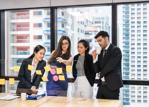Multiethnic Creative Group Business People Brainstorming Using Sticky Notes Partition Desk Modern Office Business District