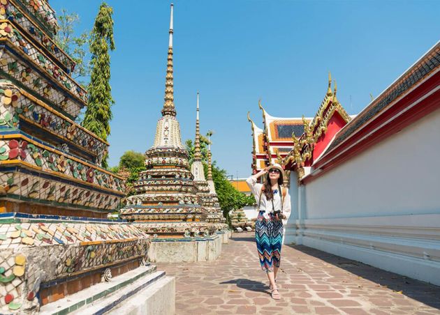 Happy Elegant Female Tourist Girl Visiting Famous Wat Pho Temple Walking Walkway Viewing Macro Building Bangkok Thailand Travel Summer Vacation
