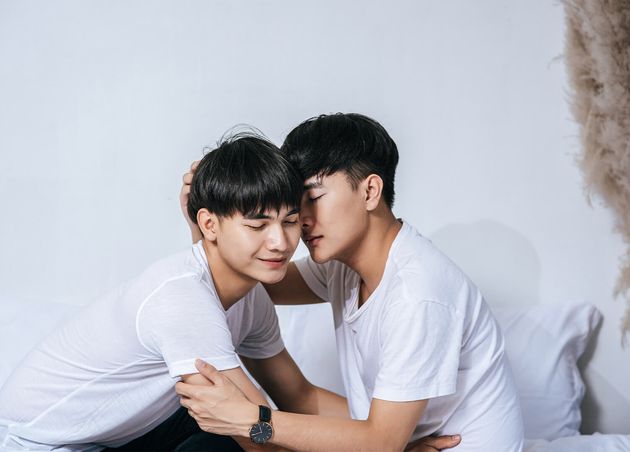 Two Loving Young Men Hugged Fragrant Cheek Each Other