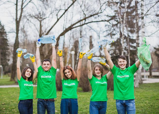 Volunteers Raising Plastic Bottles