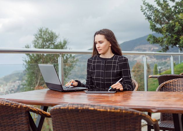 Blogger Girl Is Looking Laptop Screen by Sitting Nature View Background