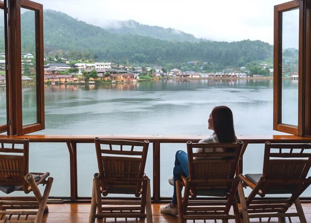 Young Woman Sitting Balcony Looking Beautiful Lake Mountains Village