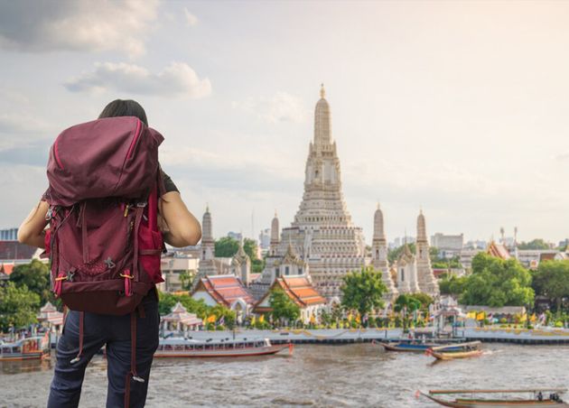Traveler Traveling into Wat Arun Ratchawararam Ratchawaramahawihan Temple Bangkok Thailand