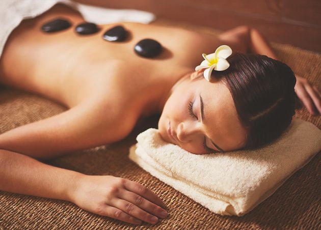 Woman Enjoying Stone Massage