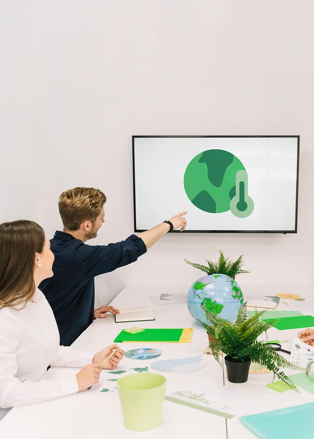 Businessman Showing Global Warming Icon His Colleagues Screen