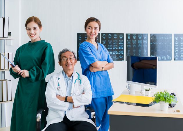 Hospital Doctor Nurse Successful Teamwork Asian Expert Person Smile with Happiness Confident with Clinic Background