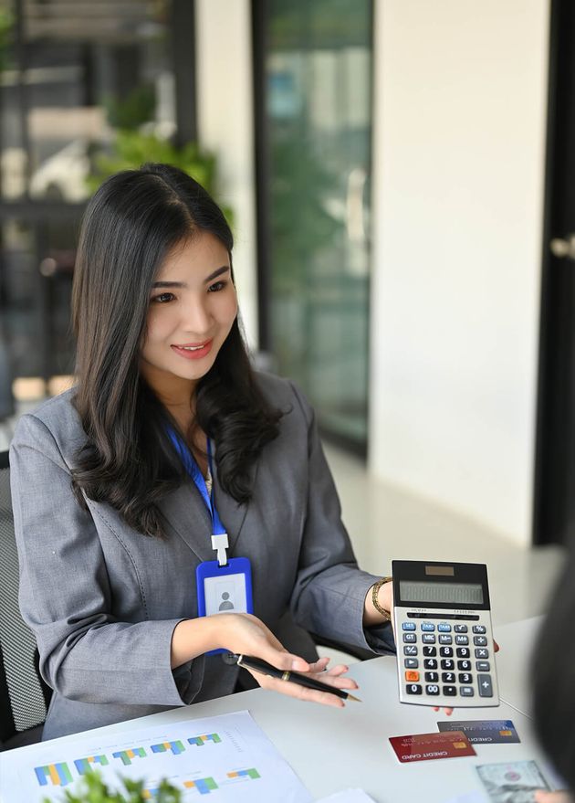 Asian Female Banker Explaining Showing Profit Margin Calculator Customer