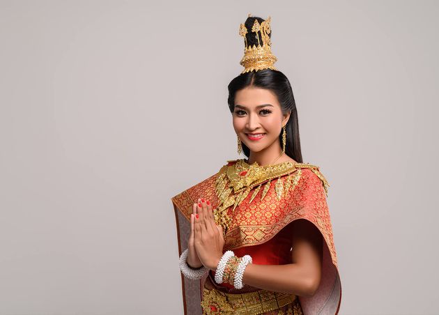 Women Wearing Thai Clothing that Pay Respect Sawasdee Symbol