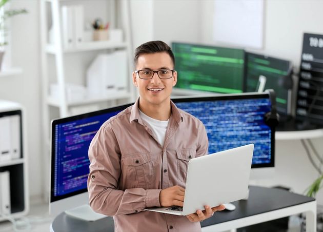 Portrait of Male Programmer in Office