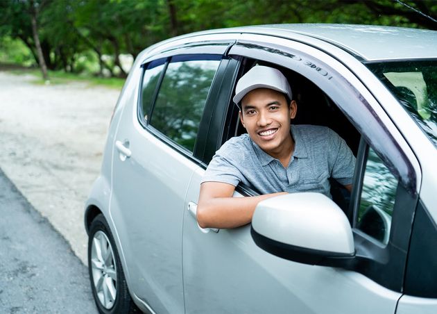 Asian Driver Look out from Open Window with Smile
