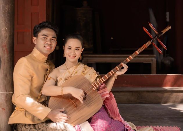 Beautiful Couple Playing Grajabpi Traditional Thai Music Instrument