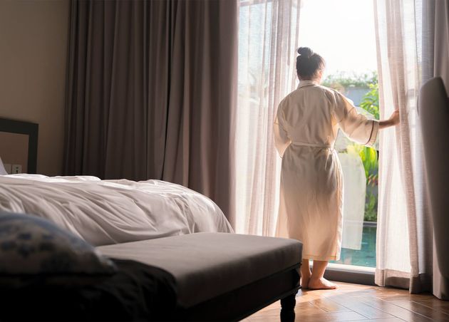 Young Asian Female Woman Stand Open White Curtains Sheer Window Morning after Waking up Bedroom Hotel Woman Wake up with Fresh Open Curtains Windows