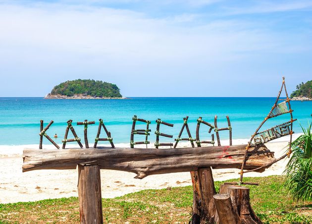 Tropical Beach Thailand Island Phuket Inscription Kata Beach from Tree Branches