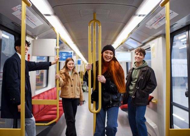 Medium Shot Teens Traveling by Public Transportation