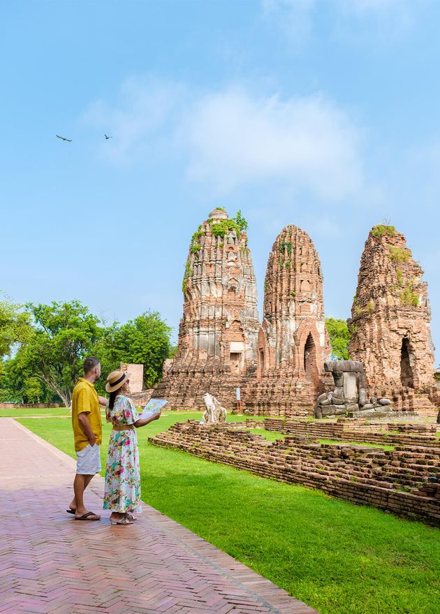 Ayutthaya Thailand Wat Mahathat Couple Men Women with Hat Tourist Map Visiting Ayyuthaya Thailand