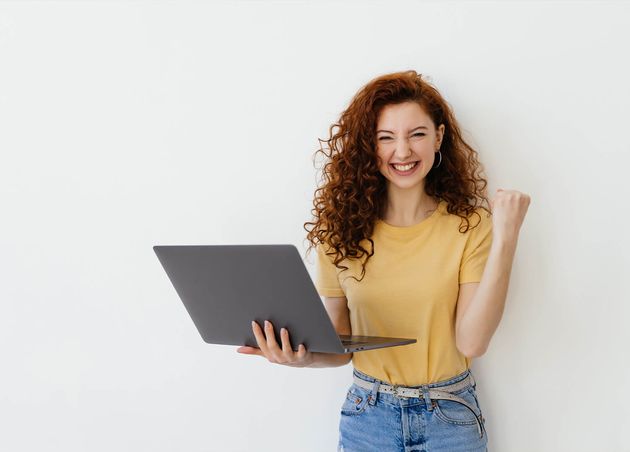 Portrait Pretty Young Woman Celebrating Success Laptop Isolated White Background