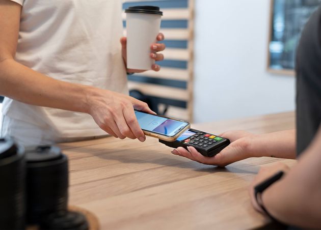 Person Paying with Own Smartphone Wallet App