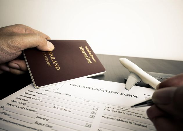 Tourist Is Filling Visa Application Form