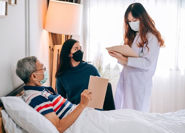 Asian Doctor Visit Examines Senior Man Home Doctor Checking up Consulting Retirement Health Partienthospital Services Wearing Mask Protect Covid19