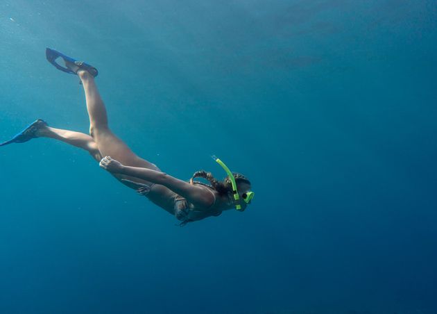 Woman with SCUBA Gear Swimming Ocean