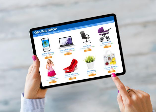 Woman Shopping Online Store by Using Tablet Computer