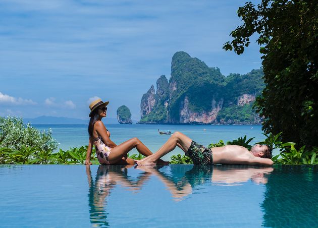 Couple Men Women Infinity Pool Looking out Beach Koh Phi Phi Thailand