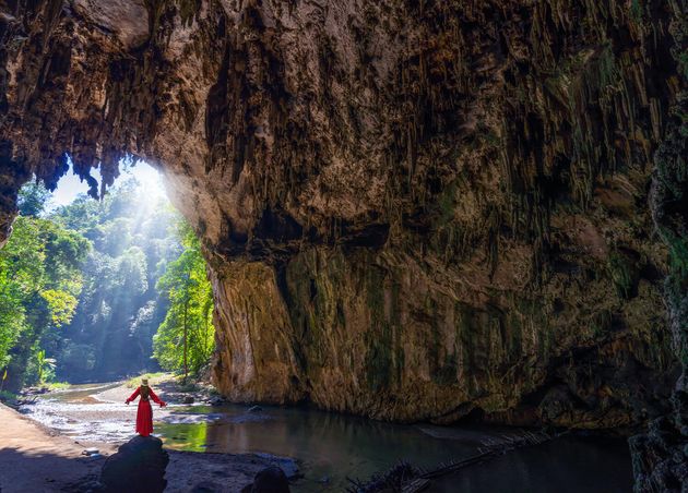 Women Tourist Stand Rock inside Tham Lod Cave Maehongson Province Thailand