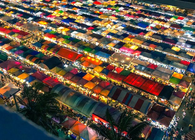 Aerial Shot Colorful Market Tents with Lit Lights Night Time