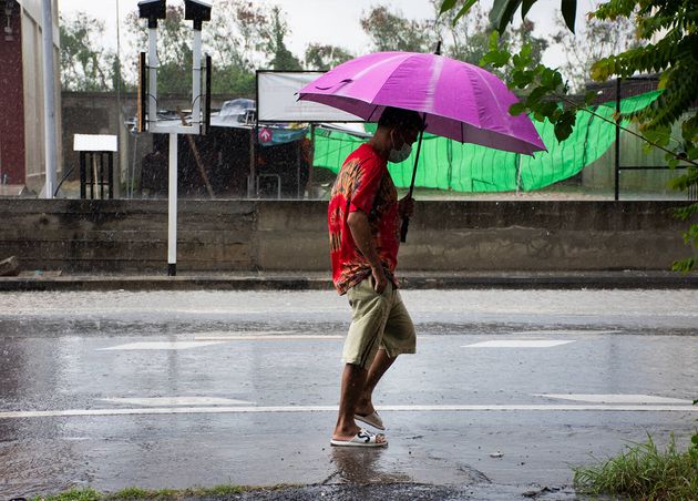 Travelers Local Men Walking Holding Umbrella with Thai People Driving Riding Biking Street while Weather Raindrop Raining Storm Bangbuathong City Nonthaburi Thailand