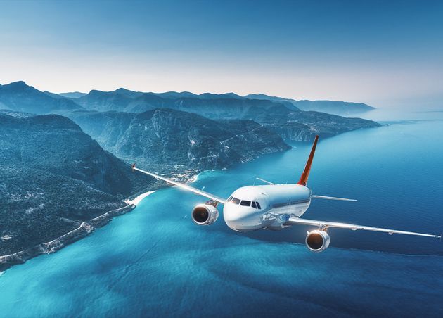 Aircraft Is Flying Islands Sea Sunrise Summer Landscape with White Passenger Airplane
