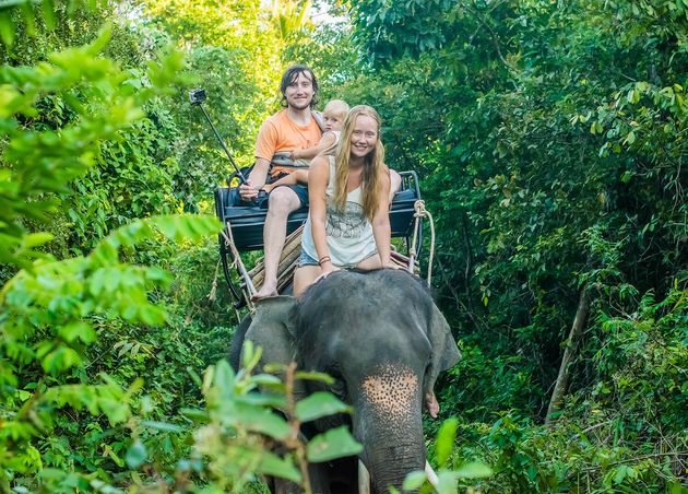 Happy Family Riding Elephant Thailand