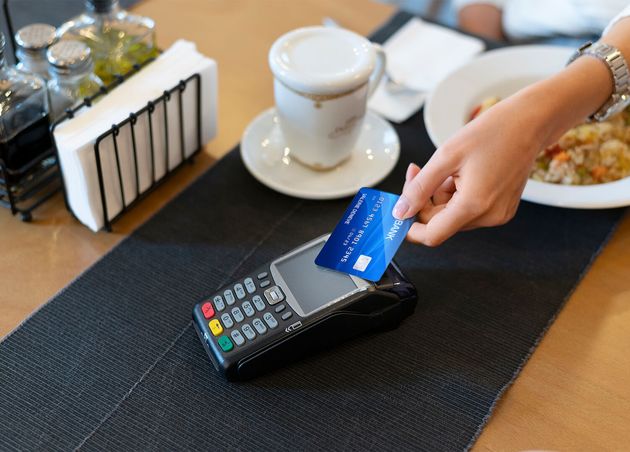 Person Paying with Its Credit Card