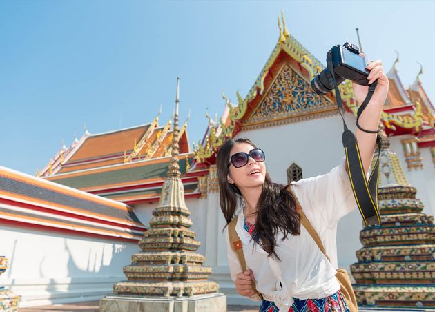 Pretty Leisurely Girl Holding Camera Taking Picture Selfie with Wat Pho Temple Bangkok Thailand Travel Summer Vacation Holiday