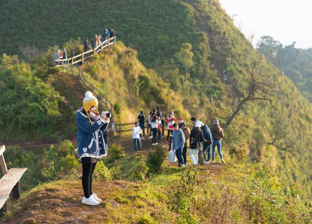 Some Tourists Travel at Phu Chee Daw Mountain in Chiang Rai Thailand