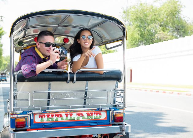 Young Couple Tourists Traveling Local Tuk Tuk Taxi Bangkok Thailand