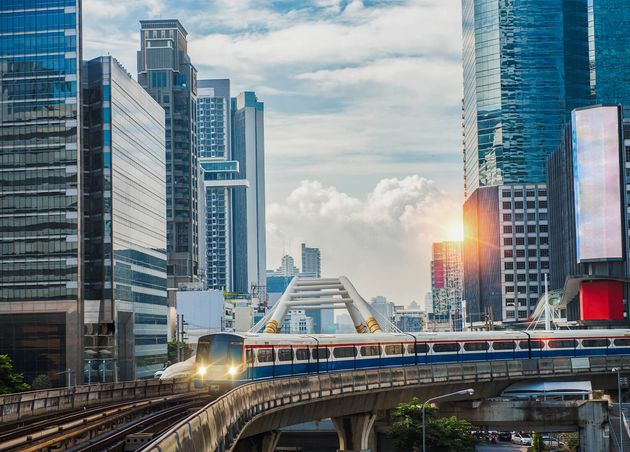 Bts Skytrain Electric Train Running Way with Business Office Buildings Background