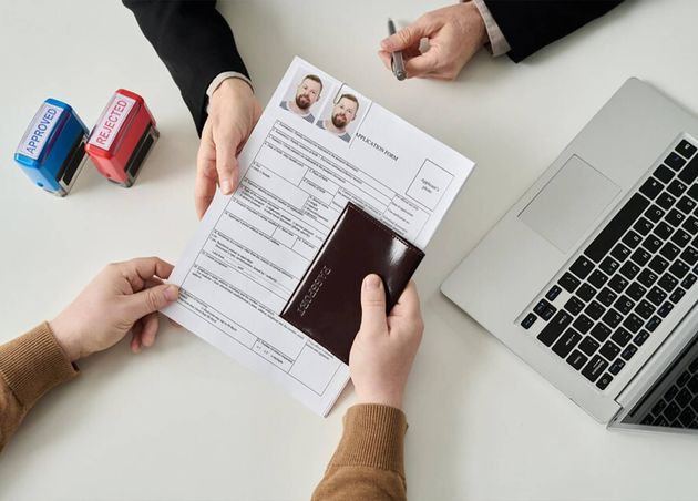 Top View Unrecognizable Man Applying Visa Immigration Office Handing Documents Work