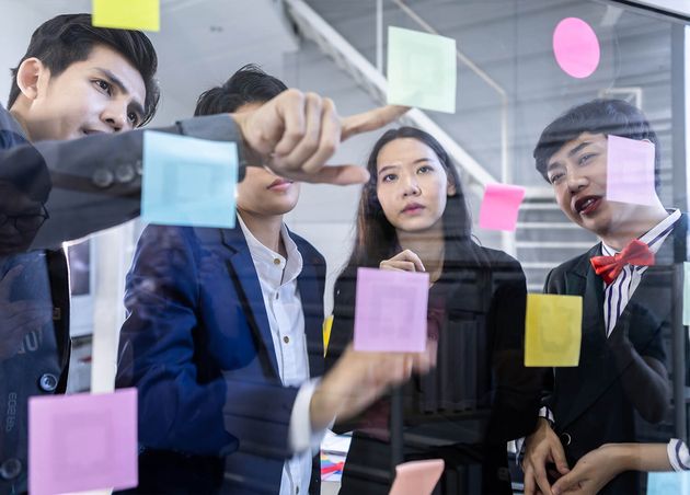 Successful Happy Workers Group Asian Business People with Diverse Genders Lgbt Use Post It Notes Share Idea Brainstorming Concept Sticky Note Glass Wall Meeting Room Office