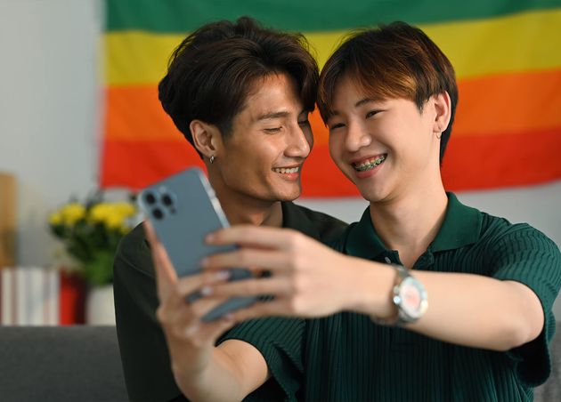 Romantic Young Gay Couple Taking Selfie with Smartphone Living Room Rainbow Flag Background Lgbt Love Concept