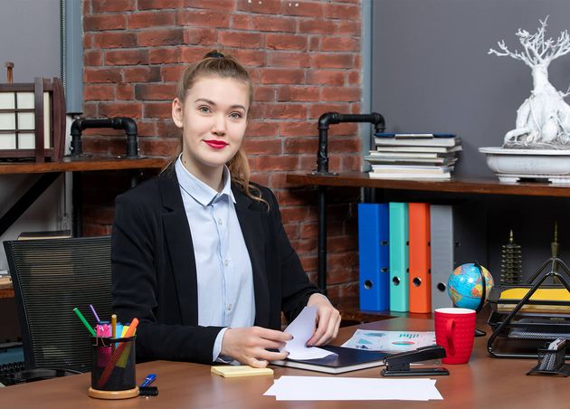 Top View Young Female Office Worker Sitting Her Desk Posing Camera