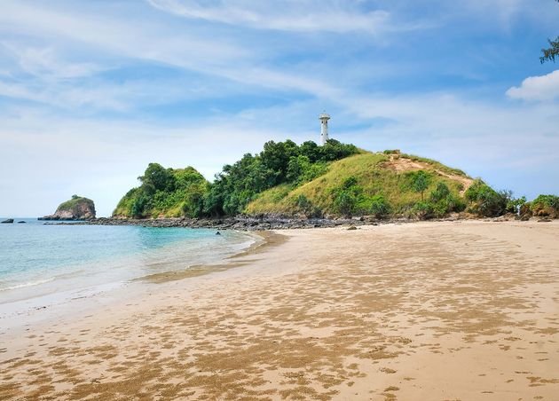 View Beautiful Tropical Beach Background Green Rocks with White Lighthouse Blue Sky with Clouds Koh Lanta Thailand