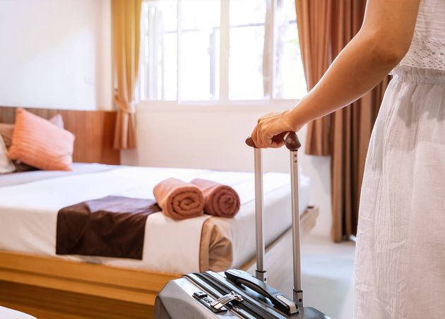 Young Woman Traveler with Luggage Hotel Room Summer Vacation