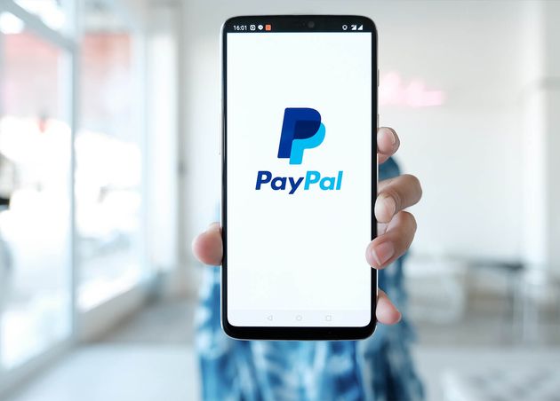 Woman Hands Holding Smartphone with Paypal Apps Screen Paypal Is Online Electronic Payment System